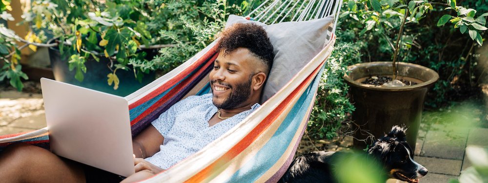Man relaxing in a hammock.