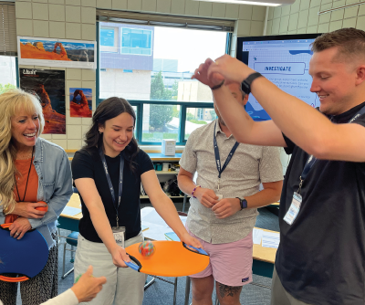 Teachers learn a science-based classroom activity.