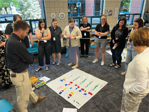 A group of teachers learning teaching strategies for early grade math.