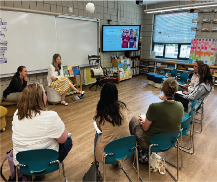 A group of teachers having a discussion in a classroom.