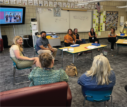 Teachers engage in a discussion focused on inclusive education.