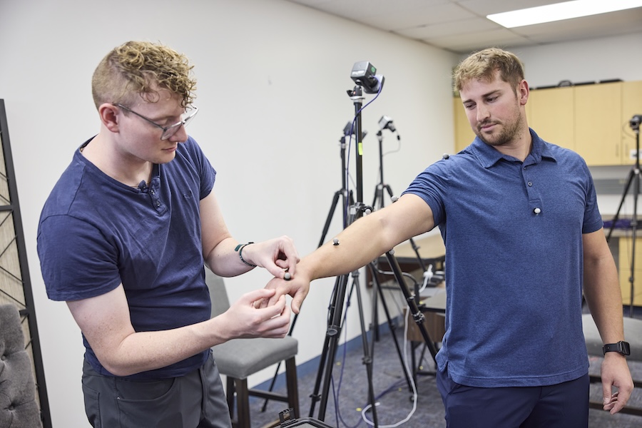 Two students practicing measurements