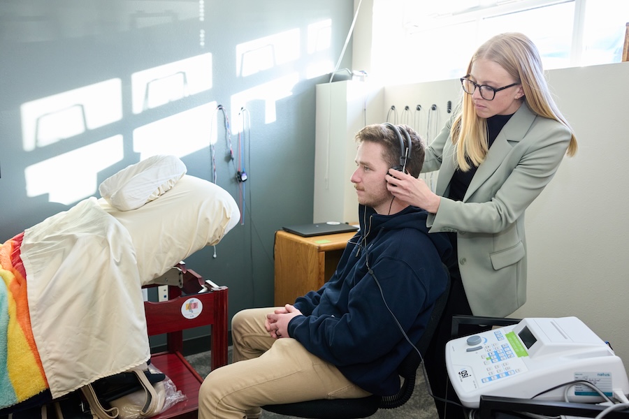 Researcher performing a heating test on client