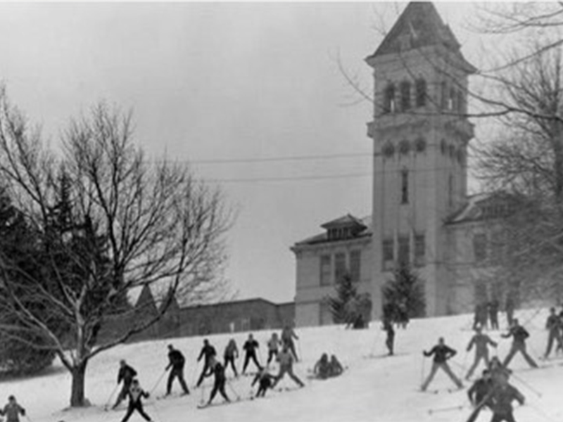 people skiing down old main