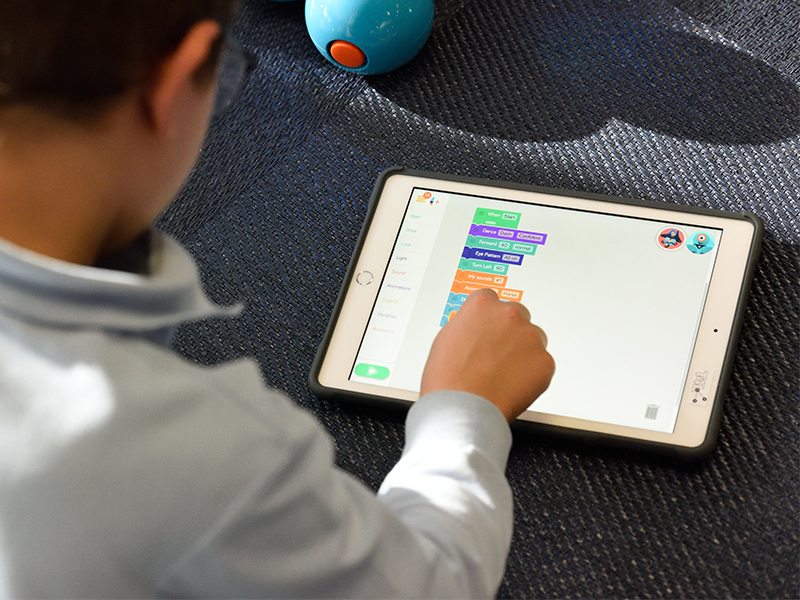 child playing on a tablet