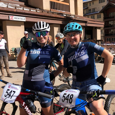 Aggies posing on their bikes for a photo