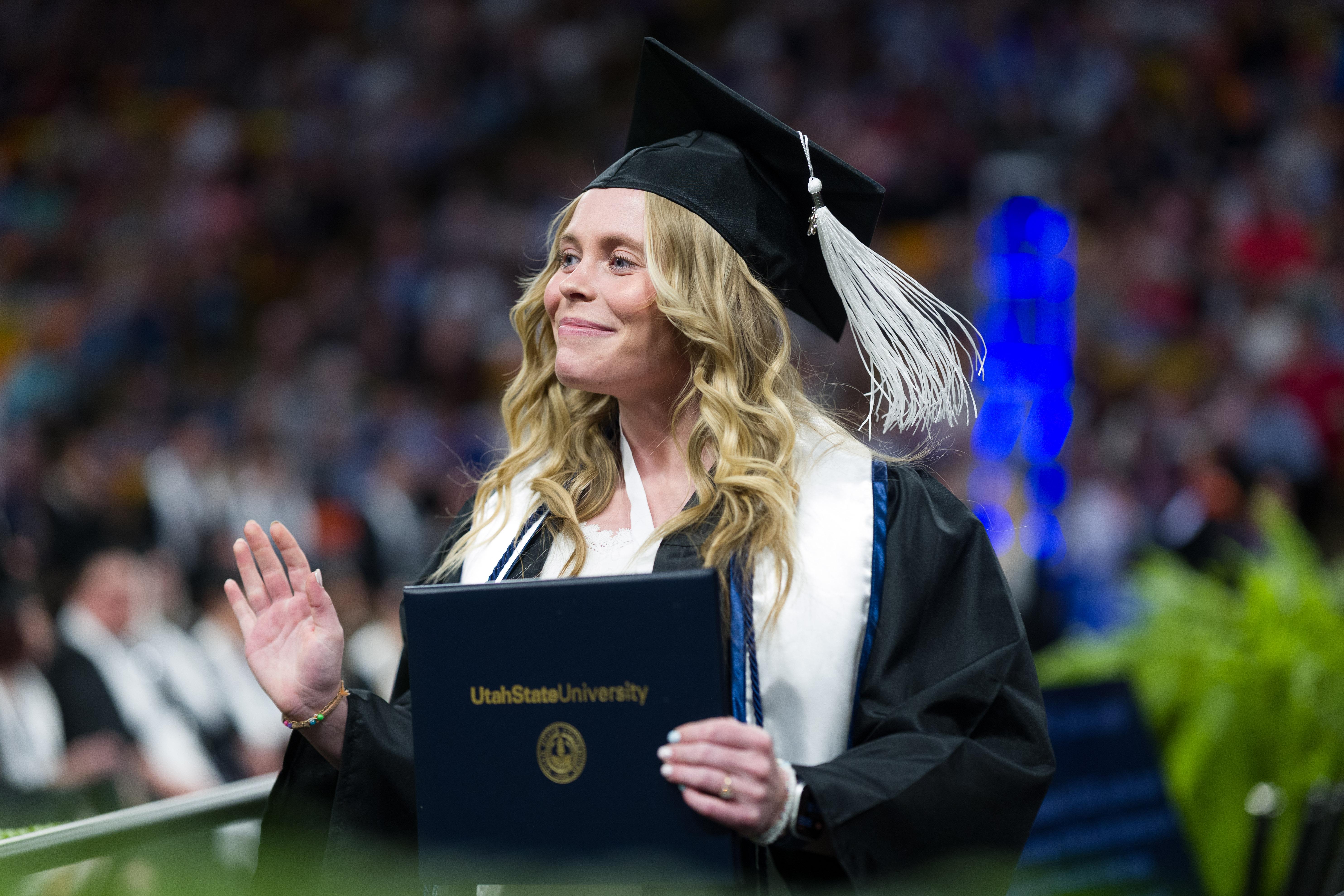 graduate accepting diploma