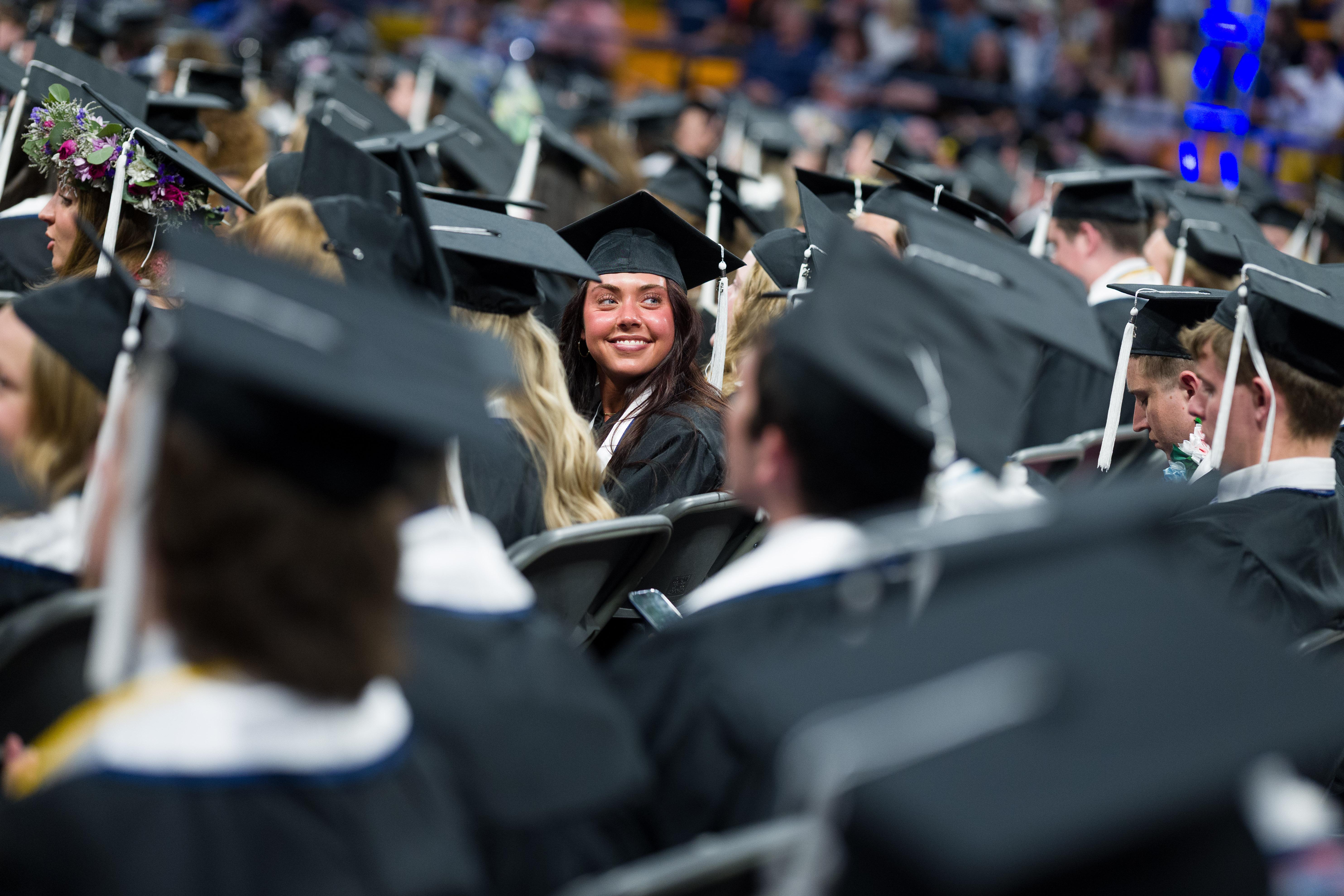 a group of graduates in cap and gown