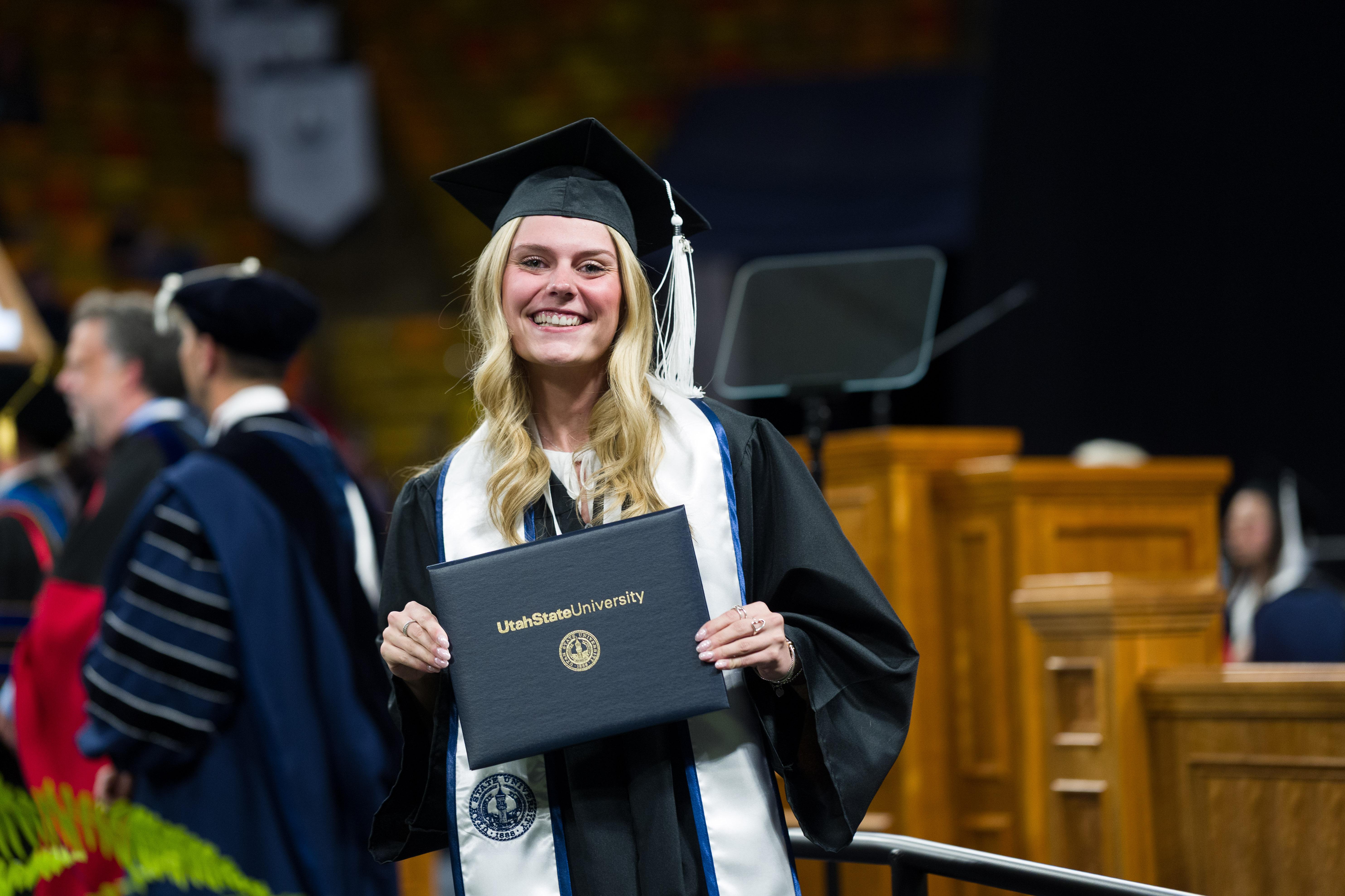 graduate flaunting diploma