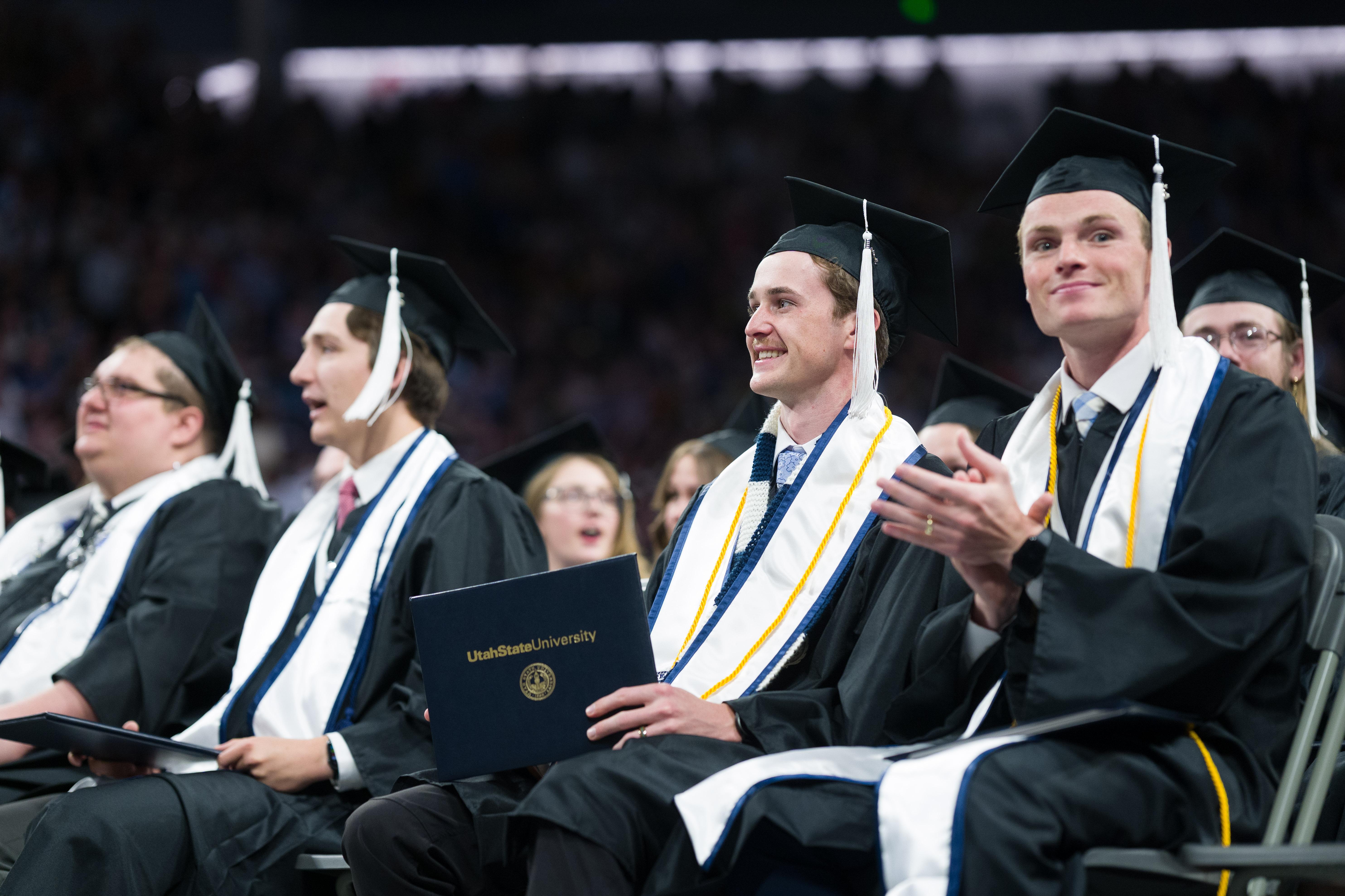 graduates sat applauding