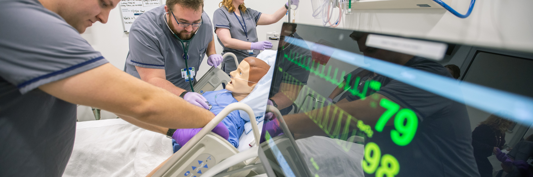 Nursing students performing an experiment in lab.