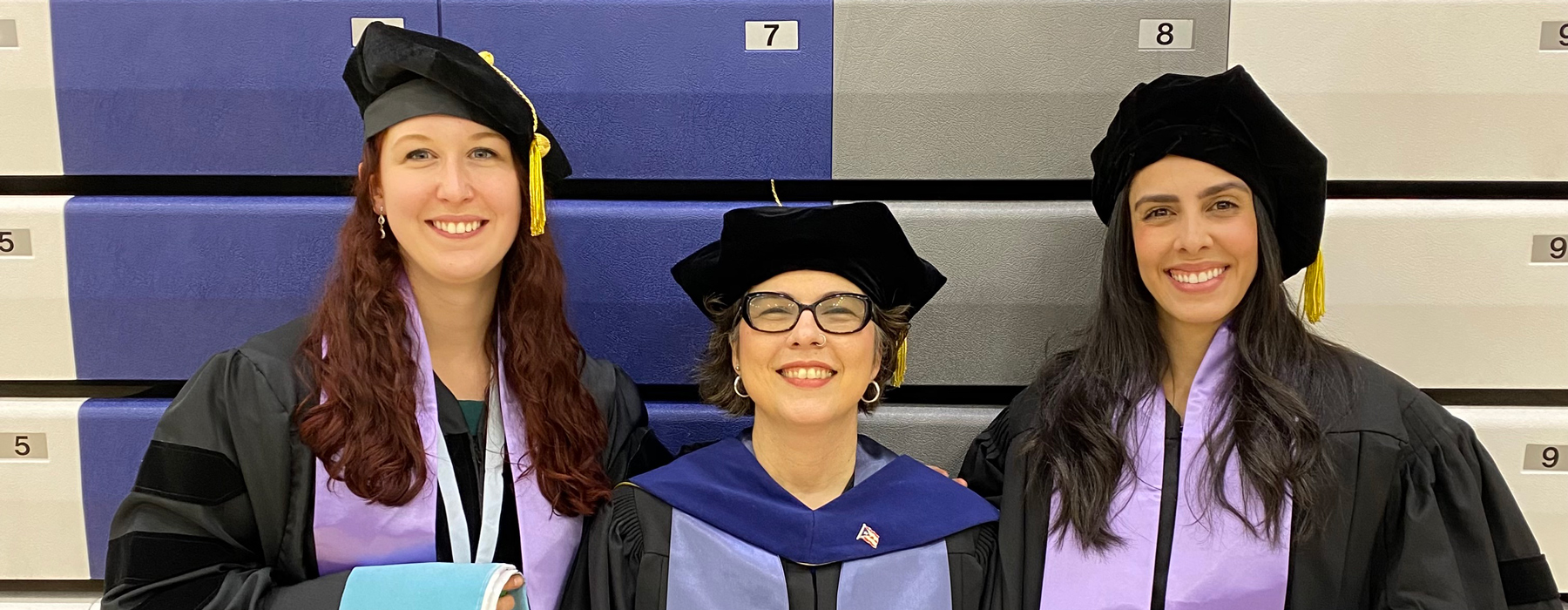 Professor Domenech Rodriguez and graduating students posing for a photo.