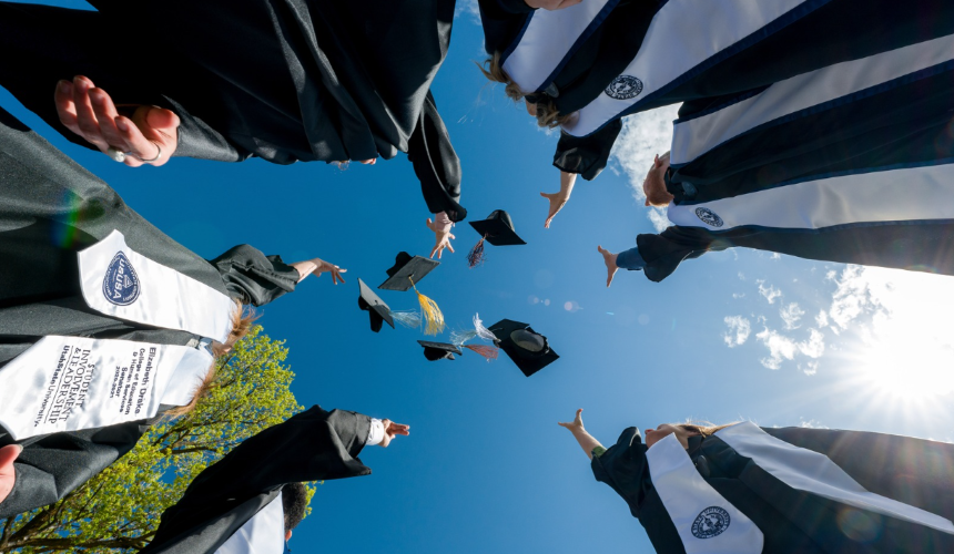 students celebrating commencement