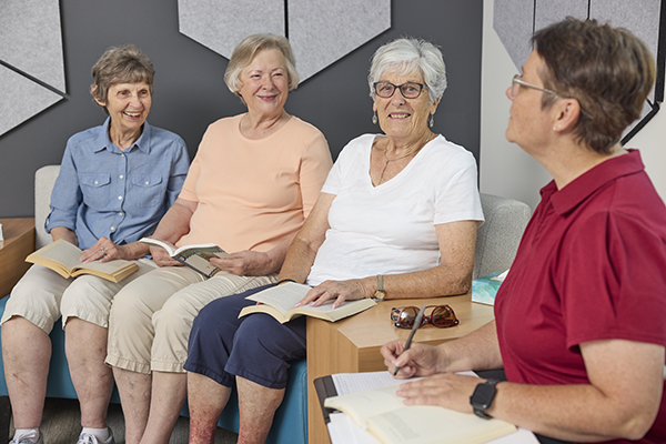 Book club gathering of 4 women.