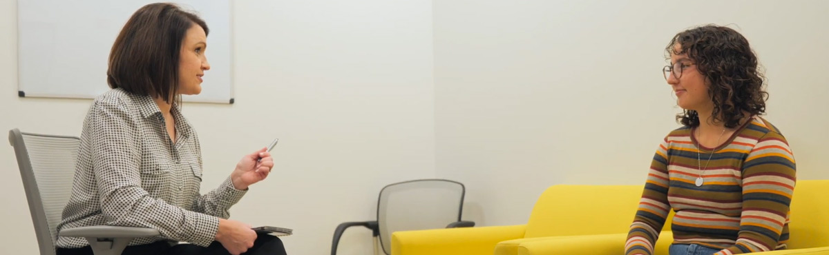 An adolescent boy and a psychologist talking