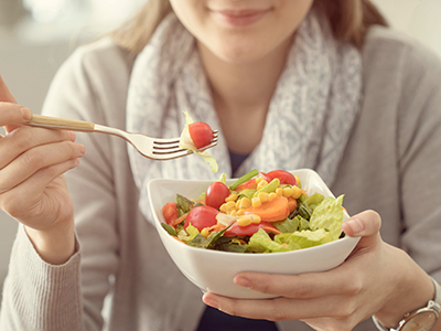 woman holding a plate of food
