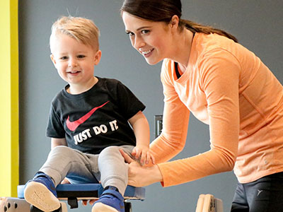 Kid and Instructor in a classroom.