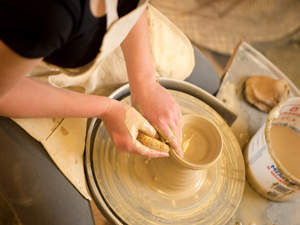 Person making pottery