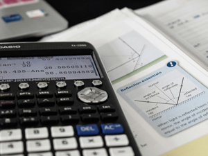 Calculator on a Math book.